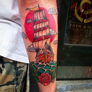 Solid looking ship tattoo by Douglas Grady. #DouglasGrady #traditionaltattoo #coloredtattoo #brightandbold #ship #rose