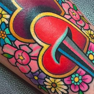 Close up heart tattoo by Sarah K #SarahK #neotraditional #heart #dagger #flowers #colorful #girly