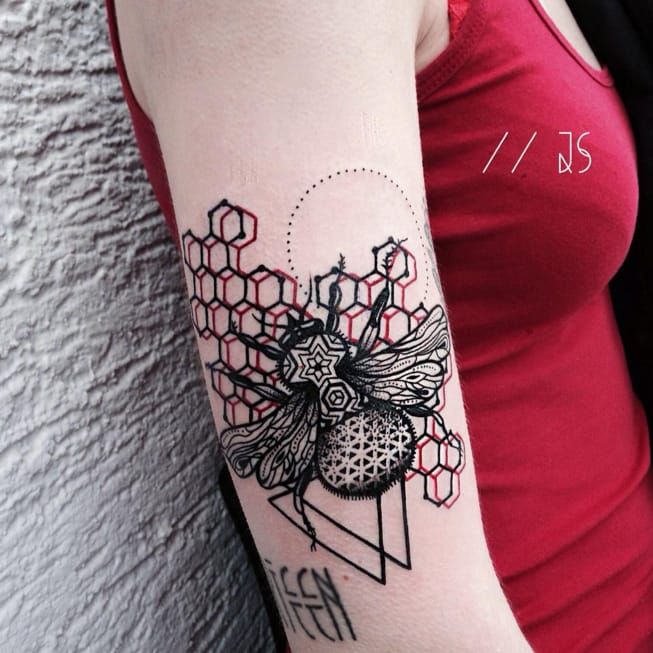 Premium Photo | A close up of a womans arm with a tattoo of a bee and  flowers generative ai