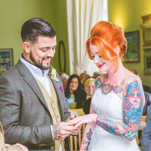 Wonderful photo of a couple tying the knot (ELS Photography). #bride #groom #honeymoon #love #marriage #rings #tattoopositive #vows #weddings