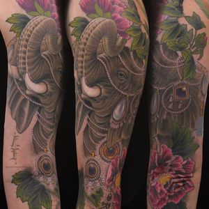 Elephant tattoo by Antony Flemming #AntonyFlemming #color #neotraditional #elephant #animal #flowers #peony #gems #jewelry #pearls #tusks #diamonds #leaves #nature #realistic #tattoooftheday