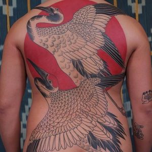 Cranes against the sun by Victor J Webster #VictorJWebster #blackandgrey #color #redink #Japanese #linework #crane #feathers #wings #sun #backpiece #tattoooftheday