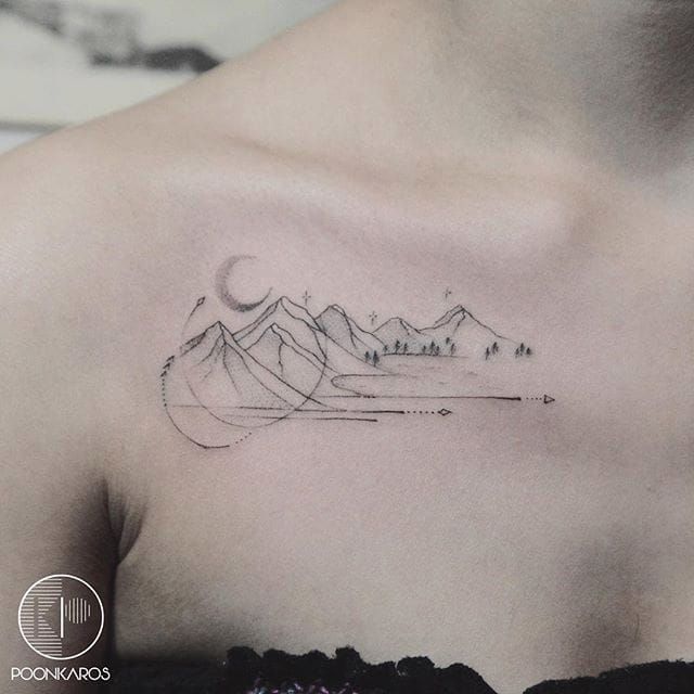 Fine line mountain tattoo on the ankle