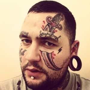 This guy is hard.  He has a knife through his eye.  I think it would be smart to hire him.  #facetattoo #knife