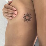 Simple and pretty sun tattoo by Jen Von Klitzing #linework #blackwork #JenVonKlitzing #ribtattoo #suntattoo