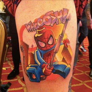An awesome tattoo of Lego Spider-Man swinging through the city. #comicbooks #Legos #SpiderMan #superheroes