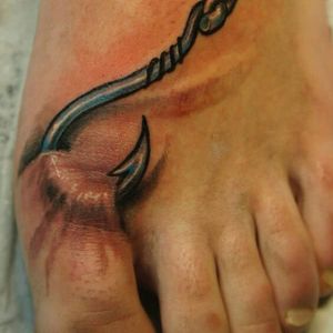 Tattoo uploaded by Tattoodo • This fish hook through a toe is incredible. # fishhook #hooked • Tattoodo