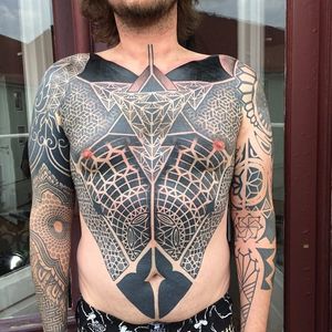 Geometric blackwork sleeves and chestpiece tattoo by Gerhard Wiesbeck @gerhardwiesbeck #geometric #blackwork #dotwork #gerhardwiesbeck