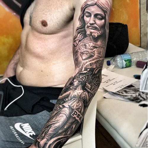 Christ with the Sacred Heart at his breast looking down on Justice by Lil B (IG—lilb_tattoos). #blackandgrey #Christ #Christian #Justice #LilB #realism #religious #SacredHeart