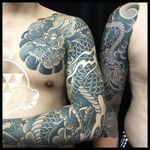 Sleeves two ways: black and grey dragon sleeve with a chest plate, and a 3/4 snake and flower sleeve. By Rhys Gordon #RhysGordon #Japanese #traditionaljapanese #sleeve #Japanesesleeve #chest #snake #sragon #chrysanthemum