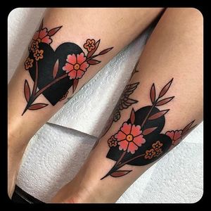 Negative space heart with flower tattoos by Leonie New. #LeonieNew #traditional #negativespace #heart #flower