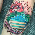 Yummy looking pastel colored cake with a rose, super cool tattoo by Katie McGowan. #katiemcgowan #blackcobratattoo #coloredtattoo #rose #cake