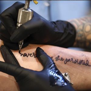 Emily Snow tattoos the now infamous words. (Via IG - jeffersonwheeler)