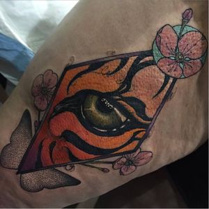 Superb eye of the tiger tattoo by Hector Cedillo #HectorCedillo #graphic #eye #tiger #dotwork #flowers