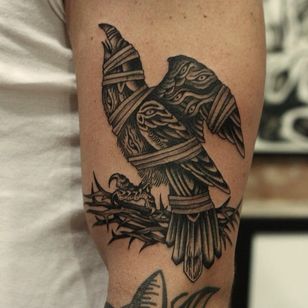 Tattoo by Franco Maldonado #FrancoMaldonado #black gray #illustrative #neutraditional #darkart #surrealistic #crow #bird #wings #feather #bound #capture #thorn #branch #three eye #ye #linework