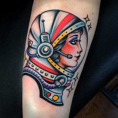 Lady astronaut tattoo by Danny Piedra #DannyPiedra #whiteinktattoos #color #traditional #ladyhead #lady #portrait #bust #astronaut #space #galaxy #stars #spacesuit #helmet #adventure #travel #tattoooftheday