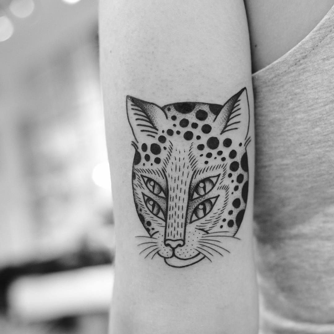 Grey Ink Leopard Eye Tattoo On Right Foot