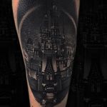 Black and grey Disneyland castle tattoo by Owen Paulls. #OwenPaulls #blackandgrey #realism #portrait #popculture #movie #film #animation #disney #disneyland #castle