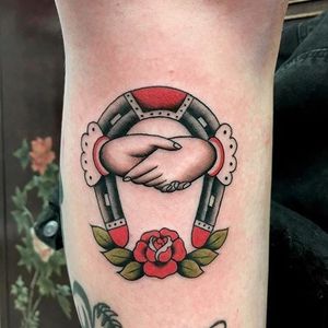 Horseshoe tattoo by Olivia Dawn. #handshake #rose #horseshoe #classic #staple #goodluck