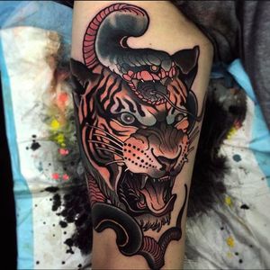 Insane looking tiger head with snake. Tattoo by Jacob Gardner. #jacobgardner #neotraditional