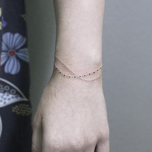 Discreet bracelet tattoo by Rachael Ainsworth #RachaelAinsworth #ornamental #dotwork #bracelet