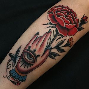 Hand holding a rose by Travis Costello. #traditional #TravisCostello #hand #eye #rose