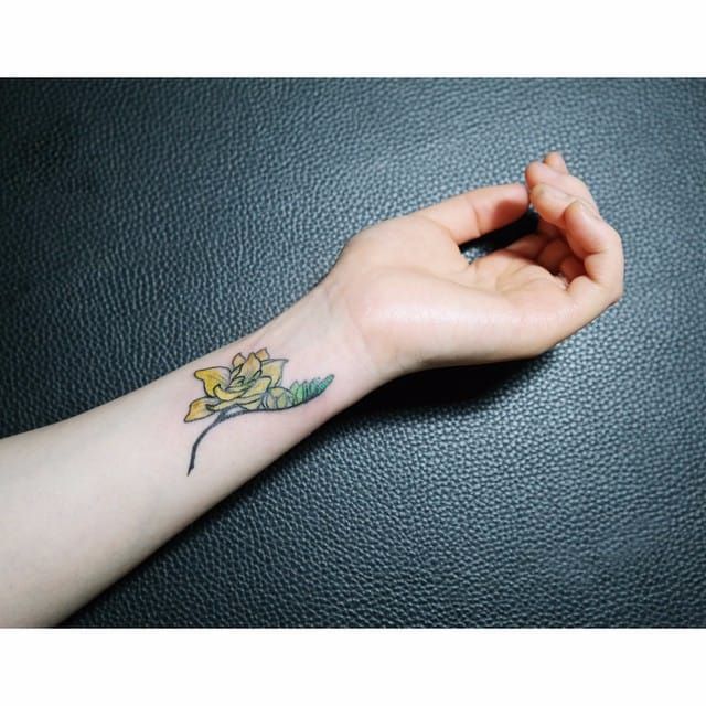 Tattoo uploaded by Stacie Mayer • Tiny freesia wrist tattoo by GZ Tattoo. # miniature #flower #botanical #freesia #GZTattoo • Tattoodo
