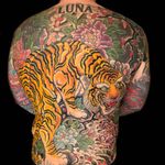 Bodysuit tattoo by Henning Jorgensen #HenningJorgensen #cooltattoos #bodysuit #color #backpiece #tiger #cat #junglecat #peony #leaves #floral #Japanese #irezumi #clouds #nature #hannya #folklore #legend #tattoooftheday