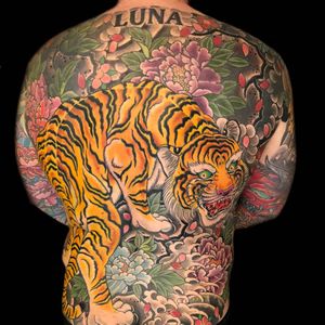 Bodysuit tattoo by Henning Jorgensen #HenningJorgensen #cooltattoos #bodysuit #color #backpiece #tiger #cat #junglecat #peony #leaves #floral #Japanese #irezumi #clouds #nature #hannya #folklore #legend #tattoooftheday