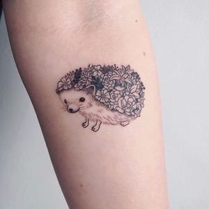 Hedgehog tattoo, artist unknown. #hedgehog #animal #flower