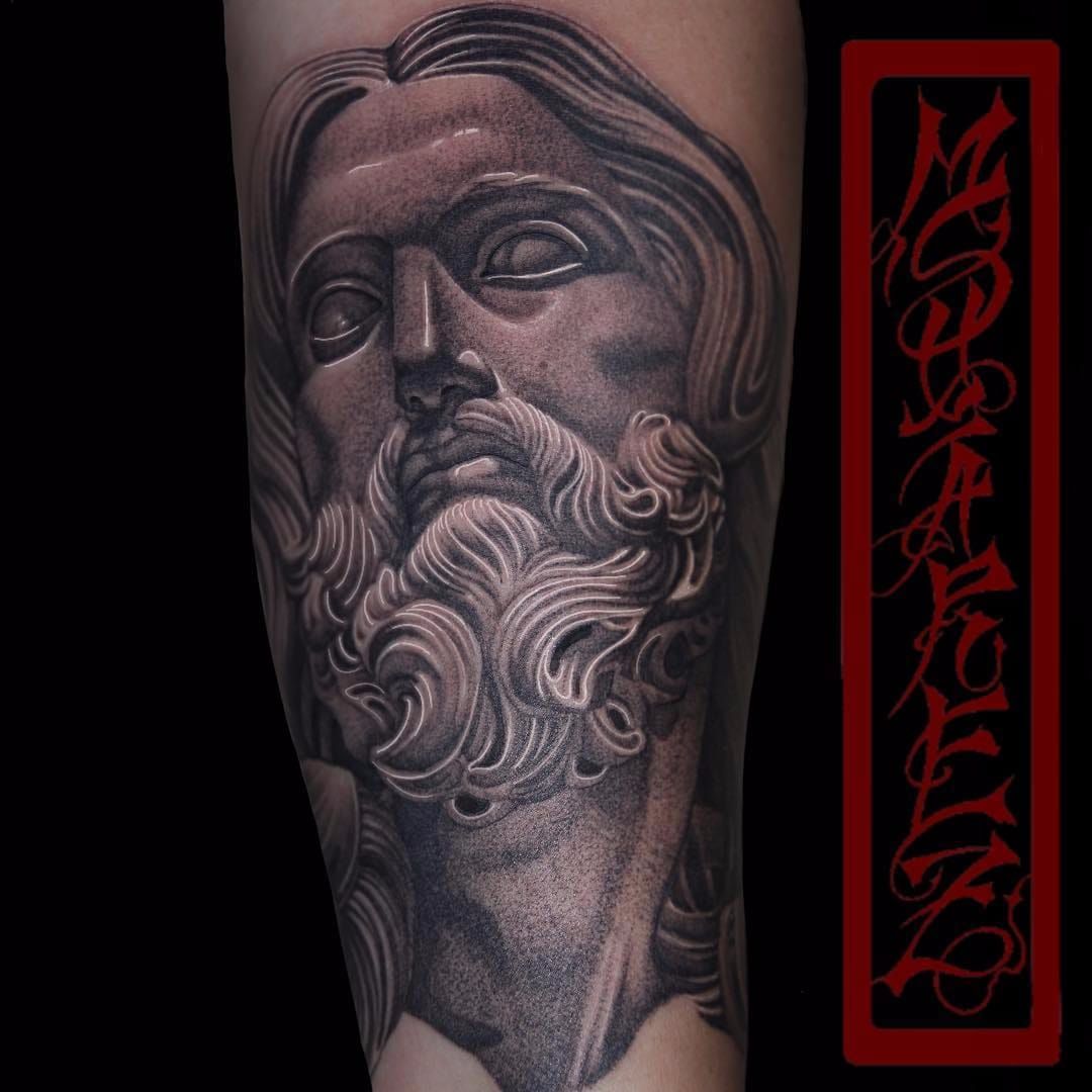 Sculpture tattoo on arm