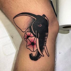 Super rad looking black elephant with blossoms. Clean tattoo work by Wilson Ng. #WilsonNg #BoldTattoos #traditionaltattoo #elephant #blossoms #traditional