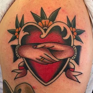Heart and handshake, solid and vibrant tattoo by Zach Nelligan. #ZachNelligan #MainStayTattoo #traditionaltattoo #classic #heart #handshake