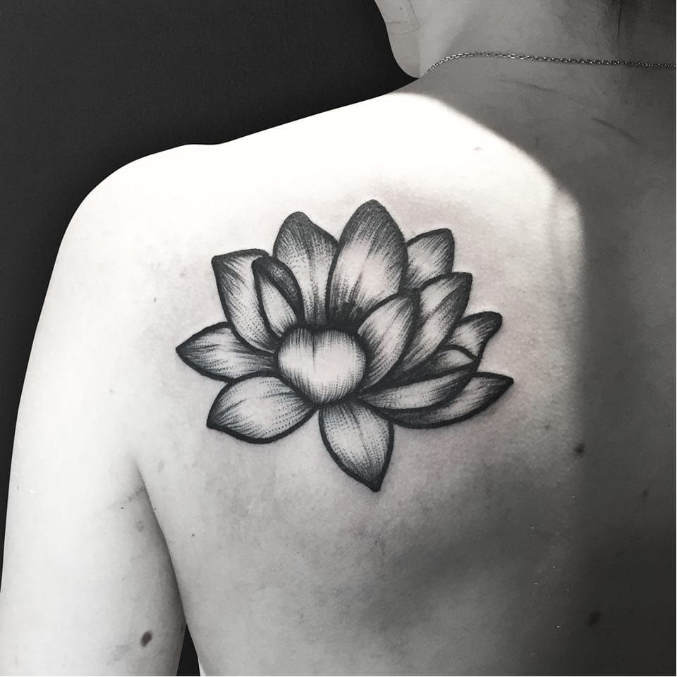 Black And Grey Lotus Flower Tattoo On Bicep