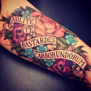 Floral tattoo that features the famous line from The Handmaid's Tale, which translates as "Don't let the bastards grind you down." #BitchPlanet #comics #dystopian #feminist #interview #KellySueDeConnick #literary #MargaretAtwood #nc #noncompliant