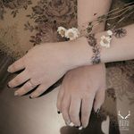 Floral bracelet tattoo by Zihwa. #Zihwa #ReindeerInk #SouthKorean #flower #floral #bracelet #band #lovely #subtle #fineline