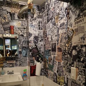The bathroom wall of New York Hardcore Tattoo is covered in band posters (IG—nyhctattoos). #NYHC #NewYorkHardcoreTattoo #punkrock