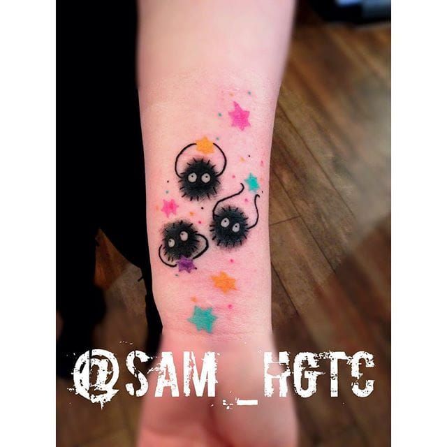 Tiny soot sprite tattoo located on the hand