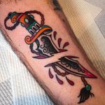 Solid looking dagger tattoo by Ben Hastings. #benhastings #traditionaltattoo #dagger