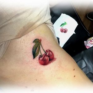 Cherry tattoo by Anderson Galindo. #cherry #fruit #sweet #realism #AndersonGalindo