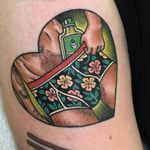 Ready and waiting. Tattoo by Guen Douglas #GuenDouglas #drinktattoos #color #newtraditional #hawaiianflowers #flowers #floral #alcohol #bottle #dude #babe #undies #underwear #cute #heart