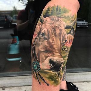 Color realism cow tattoo on a client's calf. By Whitney Havok. #realism #colorrealism #cow #animal #bovine #WhitneyHavok