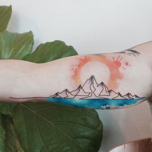 Mountain sun tattoo by Tattooist G. NO. #TattooistGNO #GNO #GNOtattoo #fineline #pastel #watercolor #mountain #sun
