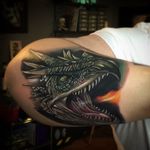Dragon head tattoo by Poch Tattoos. #realism #colorrealism #PochTattoos #dragon #dragonhead