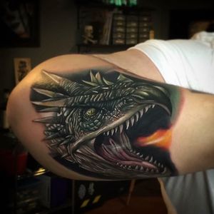Dragon head tattoo by Poch Tattoos. #realism #colorrealism #PochTattoos #dragon #dragonhead