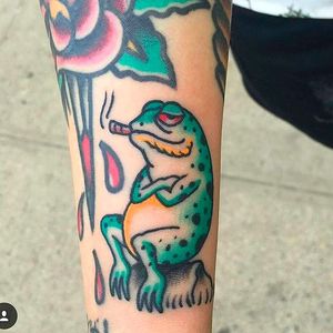 Awesome tokin' frog tattoo done by Douglas Grady. #DouglasGrady #traditionaltattoo #coloredtattoo #brightandbold #frog #toke