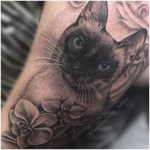 Black and grey cat and flowers tattoo by Miss Kimberley. #blackandgrey #realism #MissKimberley #flowers #cat #petportrait