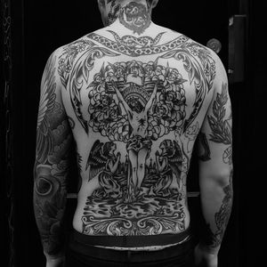 Beautiful classic Christ on the cross back piece tattoo done by Rich Hardy. #RichHardy #blackwork #traditionaltattoos #classictattoos  #americana #christ #cross #crucified #crucifix