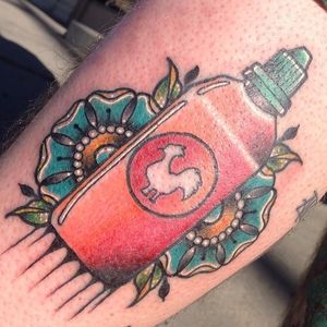 A new school spin on the traditional style. Sriracha bottle and flower tattoo by Spencer Webb. #newschool #traditional #flower #sriracha #SpencerWebb