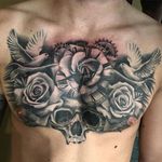 Black and grey chest piece by Chloe Aspey. #blackandgrey #realism #skull #flower #roses #bird #clock #ChloeAspey